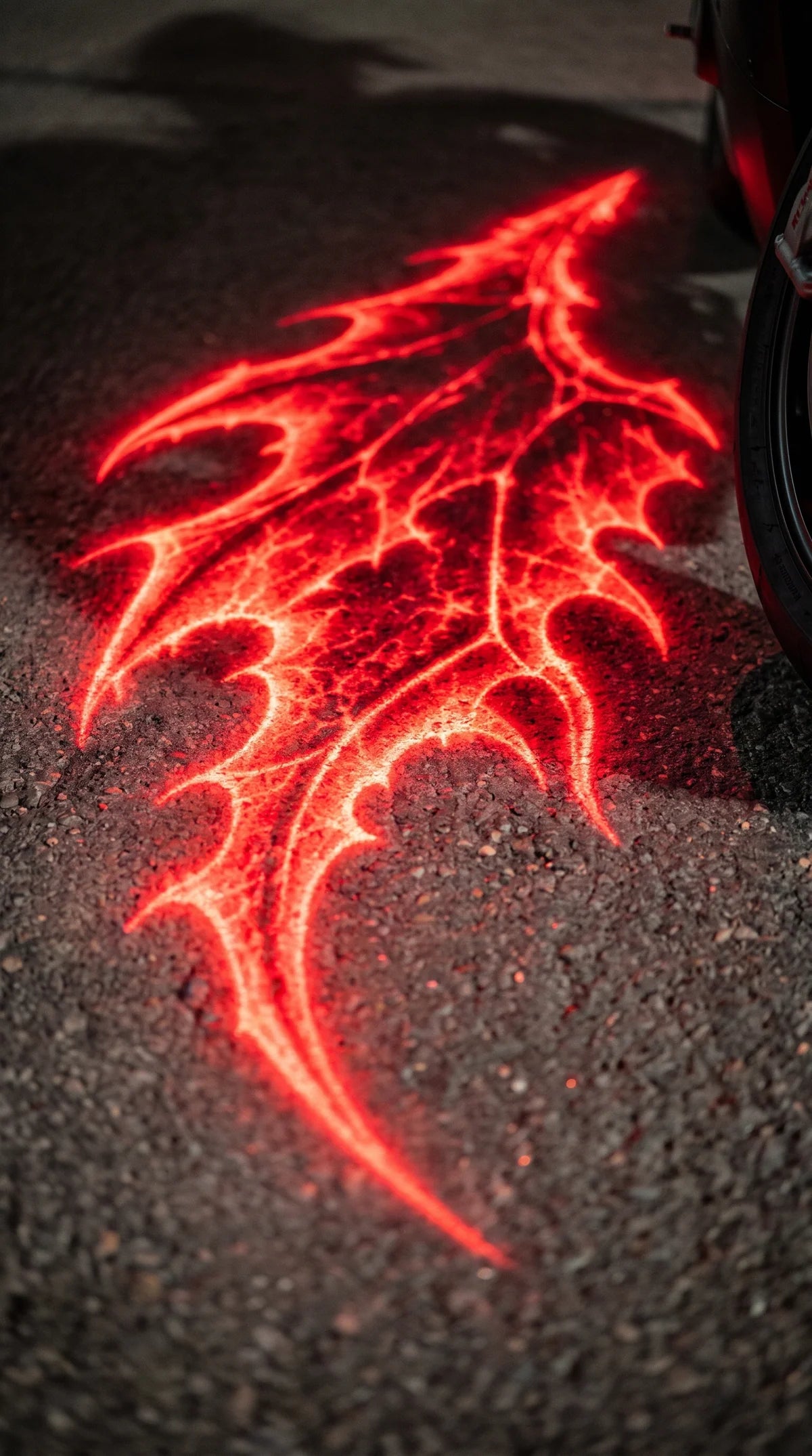 AuraWings motorcycle wing projector in use